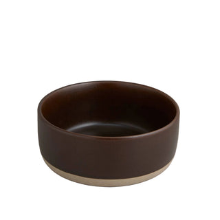Brown ceramic bowl on a light gray background