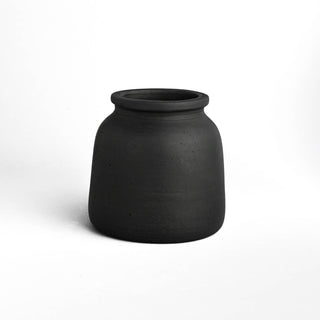 Black ceramic vase on a white background