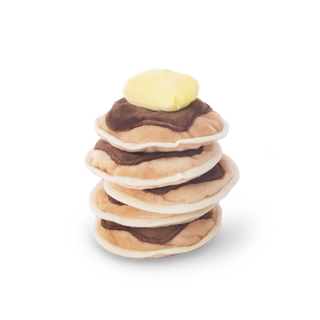 Stack of toy pancakes with a toy butter pat on a white background