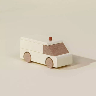 Wooden toy car on a beige background