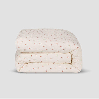 Floral-patterned quilt on a light gray background