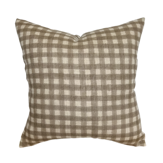 Checkered pillow with brown and white pattern on a white background