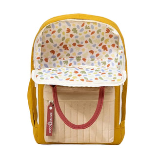 Backpack with colorful interior lining on a beige background