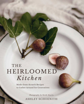Book cover of 'The Heirloomed Kitchen' with figs on a plate