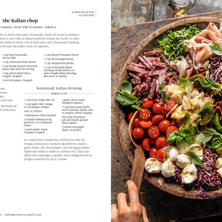Colorful Italian salad on a wooden board with text on the left side.