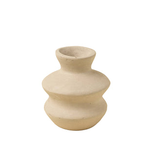 Stacked stone vases on a beige background