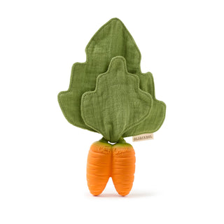 Green leafy vegetable-shaped plush toy with an orange base on a white background
