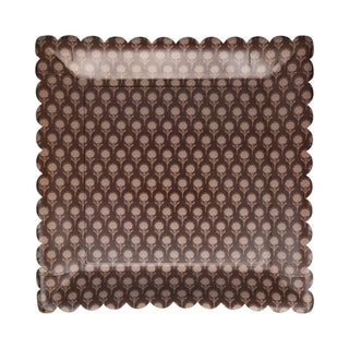Decorative pillow with a scalloped edge and brown floral pattern on a white background