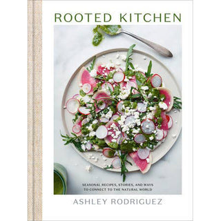 Book cover of 'Rooted Kitchen' by Ashley Rodriguez featuring a salad on a plate.