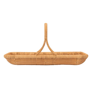 Wicker baby basket with handle on a white background