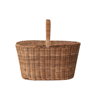 Wicker picnic basket with a handle on a white background