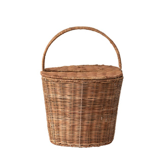 A natural brown woven wicker basket with a rounded top and a single arched handle, shown against a plain white background.