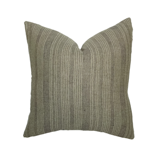 Textured green pillow on a white background