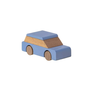 Wooden toy car with a blue body and brown roof on a beige background