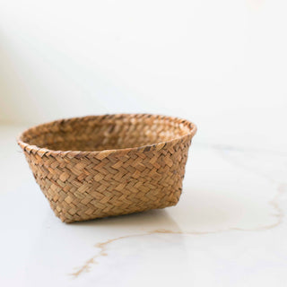 Woven basket on a white marble surface