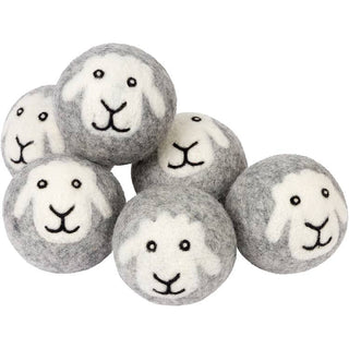Set of gray balls with white faces resembling sheep on a white background