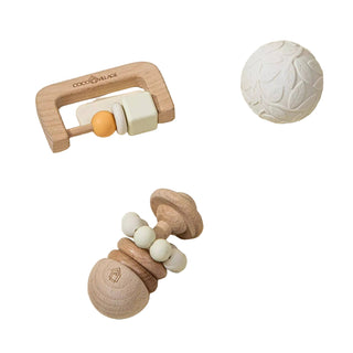 Wooden baby teething toys on a beige background